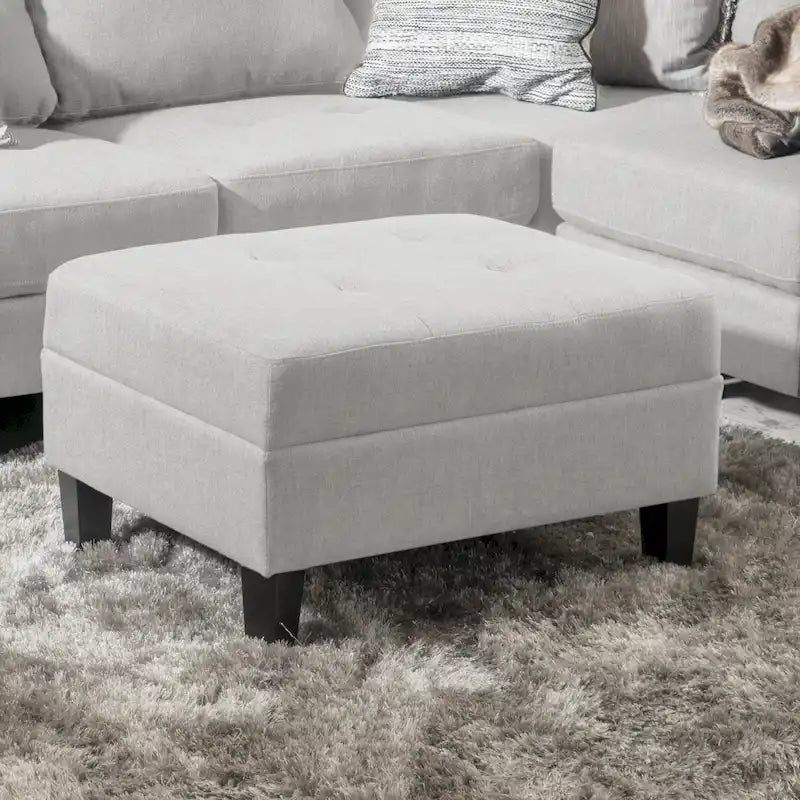 Pouf ottoman en tissu capitonné