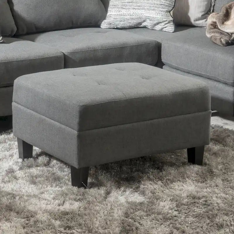 Pouf ottoman en tissu capitonné