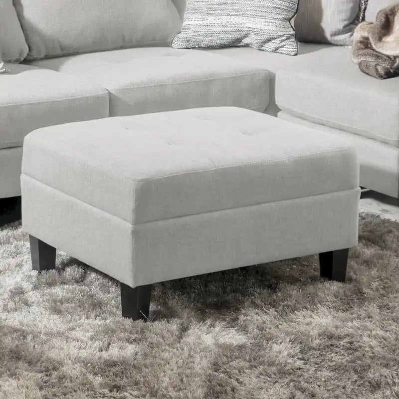 Pouf ottoman en tissu capitonné